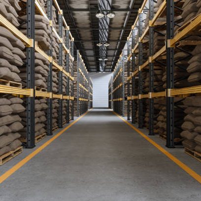 Distribution Warehouse Interior With Sack Of Grains Or Sack Of Coffee On Racks